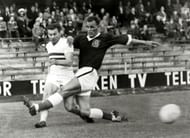 Sport, Football, pic: 1958, 1958 World Cup Finals in Sweden, Wales v Hungary in Stockholm, John Charles of Wales rushes in to challenge Hungary's Budai